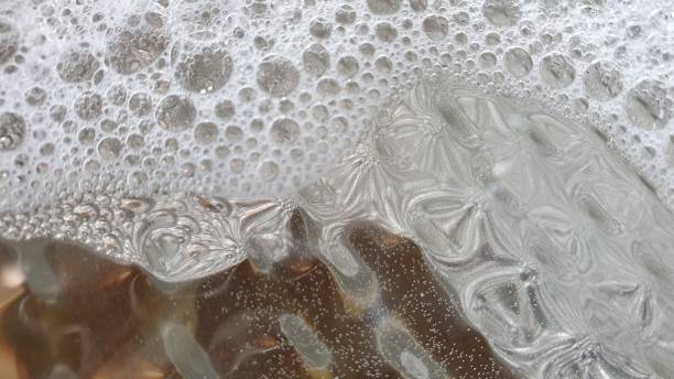 istock Soapy bubbles and reflections on metal plate 1145215589