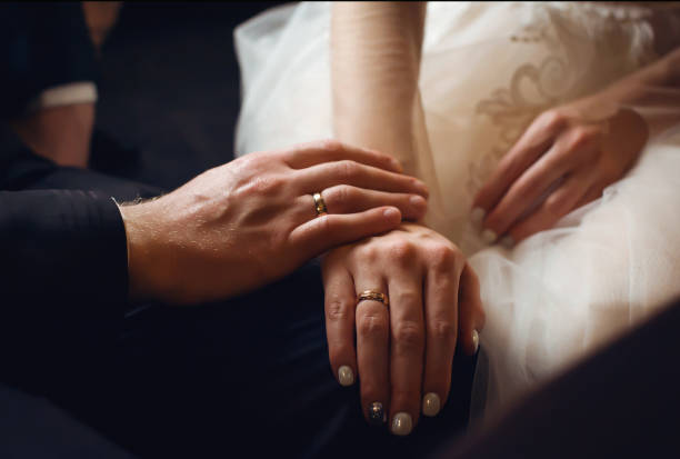 istock Hands newlyweds with rings 1145217057