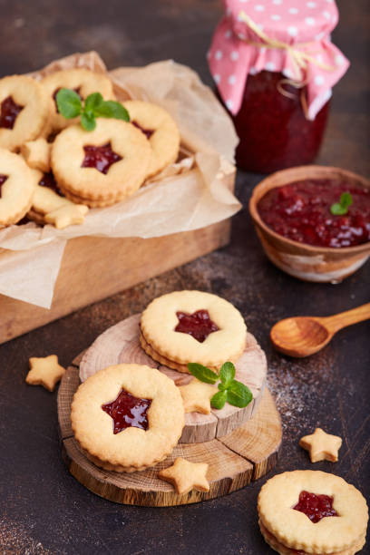 istock Linzer Christmas cookies with stars. Delicious biscuits with raspberry jam 1145219933