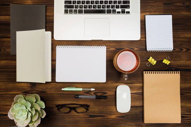 istock Top view wooden office  desk  with copy space - Image 1145222275