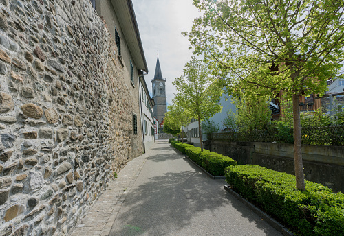 view of the old city wall and church in the Swiss village of Steckborn on Lake Constance