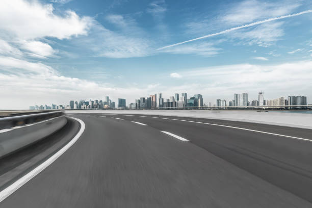istock empty asphalt road with city skyline background in china.