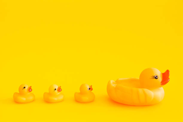 istock Yellow rubber duck isolated on a yellow background. 1145223484