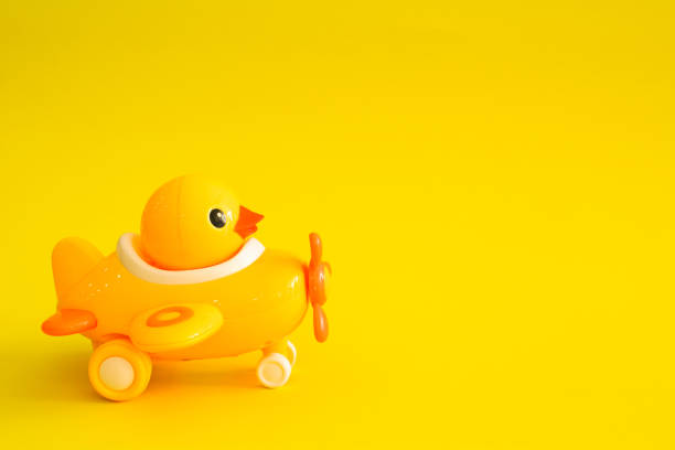 istock Yellow plane isolated on a yellow background. 1145223509