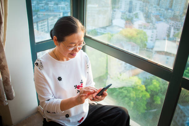 istock Senior woman using mobile phone 1145223946