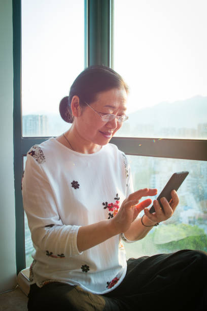 istock Senior woman using mobile phone 1145223997