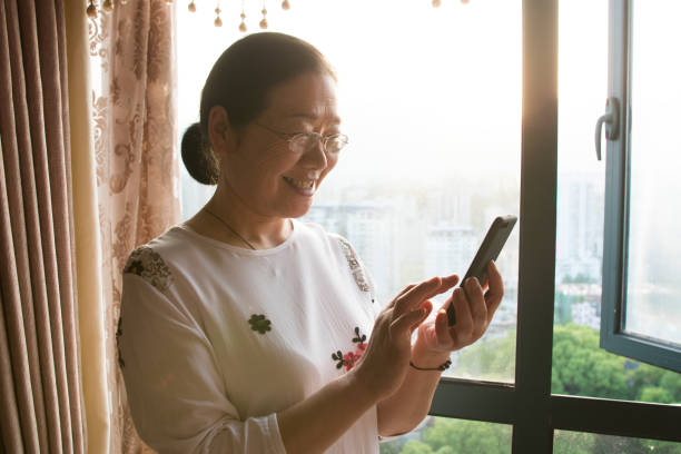 istock Senior Women enjoyment with mobile phone 1145224030