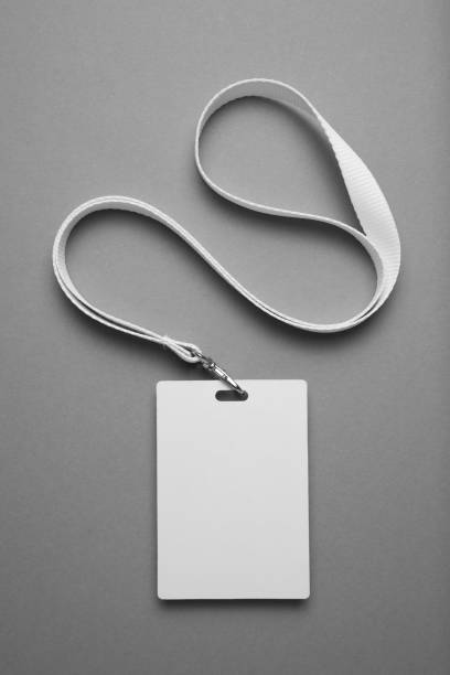 Badge, staff id mockup, name tag lanyard identification card on grey background Badge, staff id mockup, name tag lanyard identification card on grey background. pre press stock pictures, royalty-free photos & images