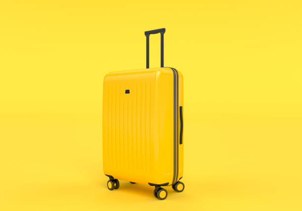 istock Luggage isolated on yellow background, 1145224833