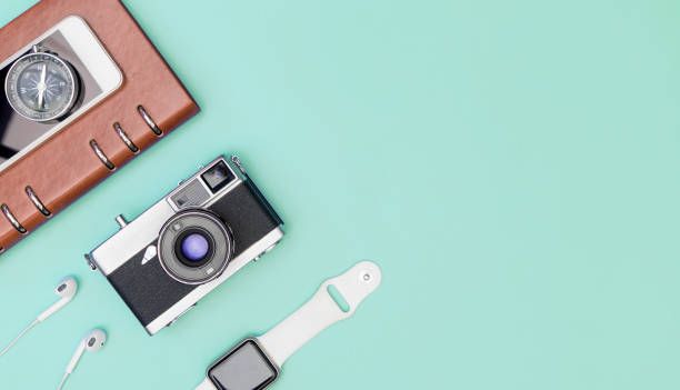 istock Travel accessories objects and gadgets top view flatlay on blue pastel 1145226205