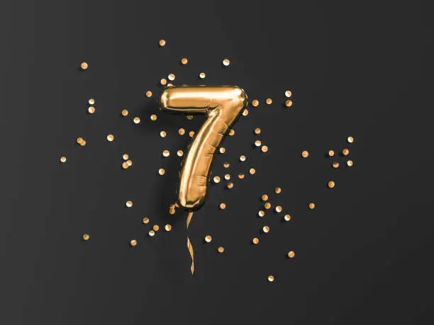Seven year birthday. Number 7 flying foil balloon and gold confetti on black. Seven-year anniversary background. 3d rendering