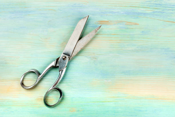 istock Vintage scissors, shot from above on a teal blue background with copy space 1145226917