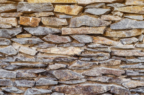 istock Wall made of fine natural stone flint 1145227627
