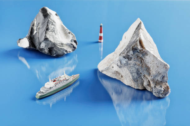 Tabletop shot with historic miniature model of passenger ship and two flints