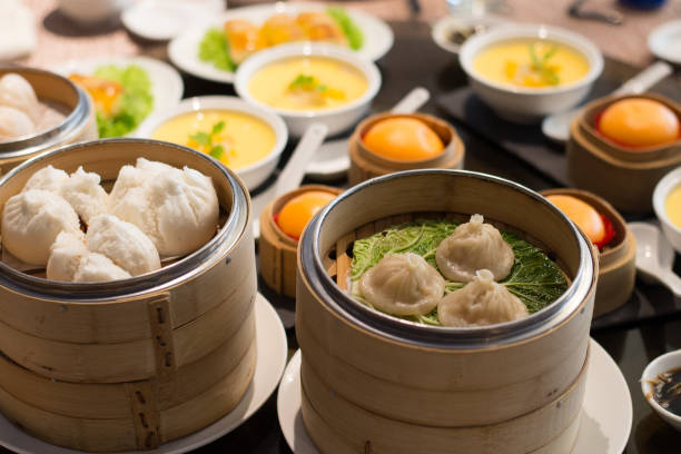 istock assorted chinese dim sum dian xin soup dumplings and puffs in bamboo baskets 1145228197