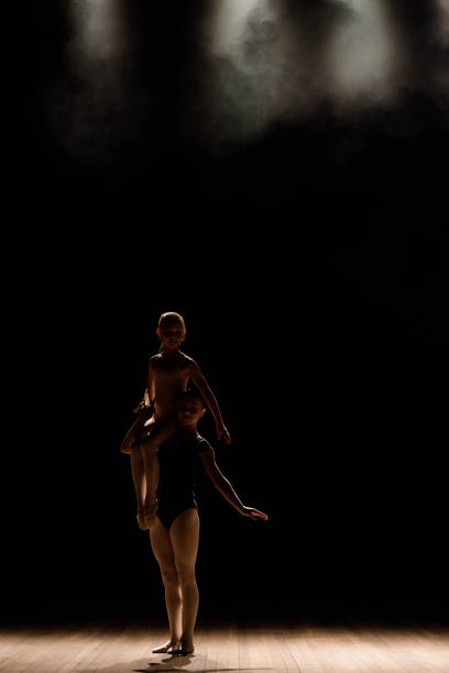 istock Acrobatic dance. Dance with elements of acrobatics. Girls doing dance support. 1145229698