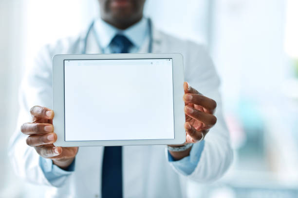 It's what the doctor recommends Closeup shot of an unrecognizable doctor holding a digital tablet with a blank screen endorsing photos stock pictures, royalty-free photos & images