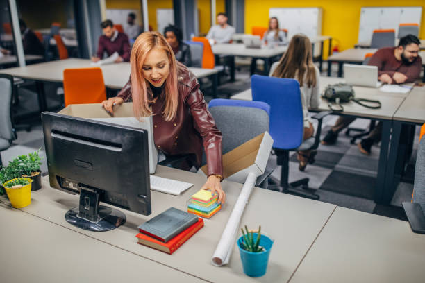 First day at the office Multi-ethnic group of people, millenials working in big modern office all together, one woman is first day at work. day 1 stock pictures, royalty-free photos & images