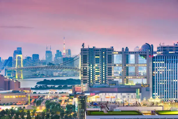 Tokyo, Japan Odaiba cityscape at twilight from across Tokyo bay.