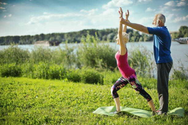 istock Yoga class outdoors. 1145232955