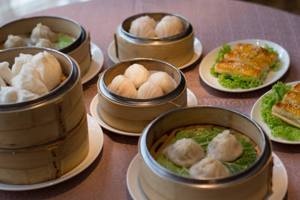 istock assorted chinese dim sum dian xin soup dumplings and puffs in bamboo baskets 1145234512