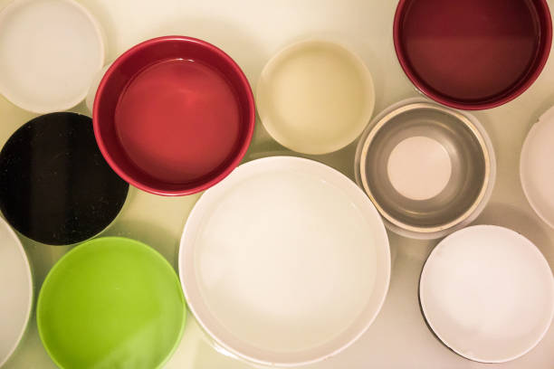 istock Abstract view of Multi Colored Plates and Bowls in Water 1145235844