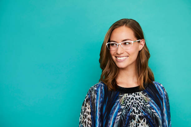 istock Smiling girl on blue 1145237425