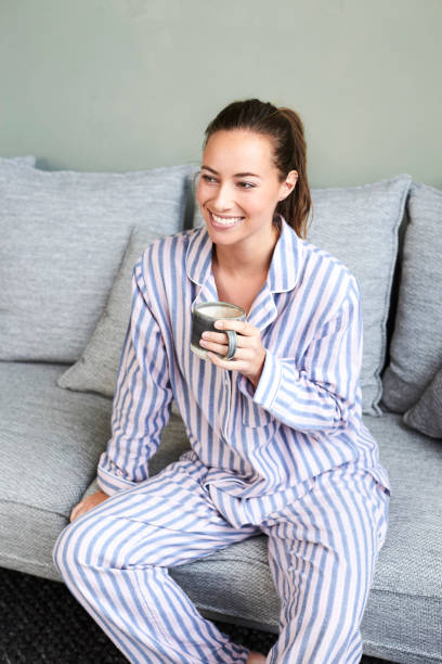 istock Pajamas girl with coffee 1145237552