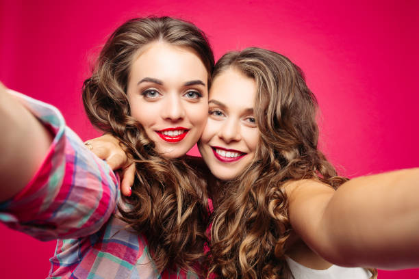 istock Pretty best friends taking selfie with camera. 1145237638