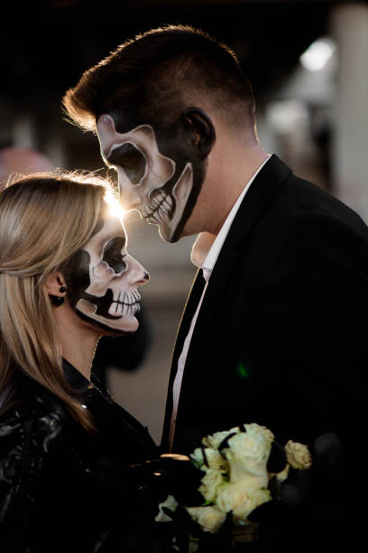 istock Halloween couple. Dressed in wedding clothes romantic zombie 1145241366