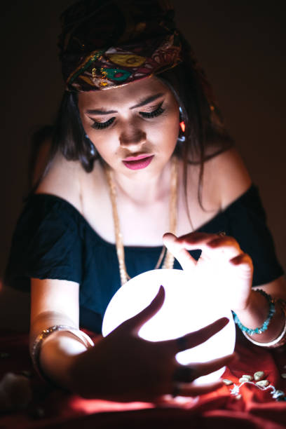 Fortune teller and crystal sphere stock photo
