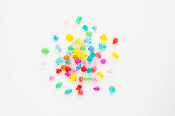 istock A scattering of many small different gems on a white background. Multicolor. Concept of explosion, burst, congratulations card. 1145249035