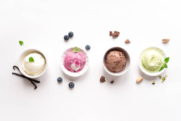Ice Cream Assortment Ice Cream Assortment. Various ice creams and ingredients on white background, copy space. Frozen yogurt or ice cream in cups - healthy summer dessert. homemade icecream stock pictures, royalty-free photos & images