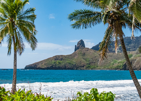 Landscape with beach, palm trees and mountains on the lonely Hiva Oa Island, Marquesas Islands, French Polynesia