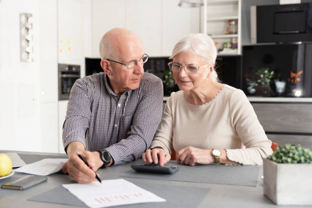 istock Senior couple discussing investment 1145251910
