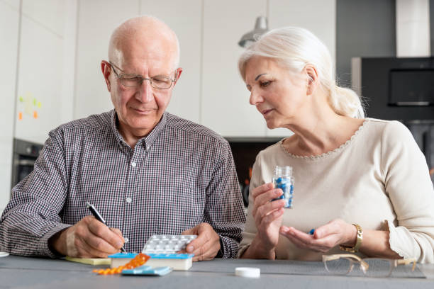 istock Senior couple talking about their medicines 1145251945