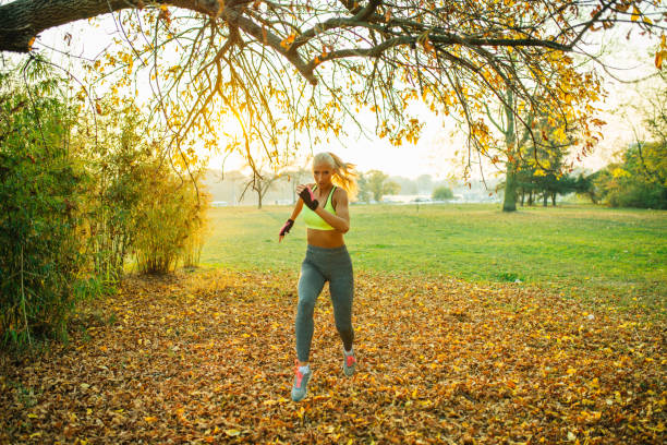 istock Sexy blonde running in the park 1145253322