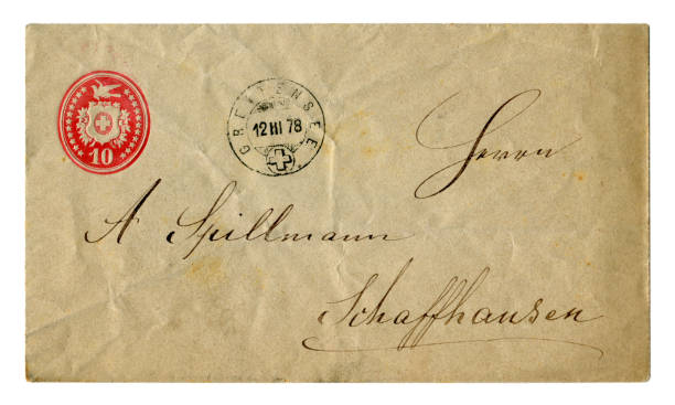 istock Old crumpled Swiss envelope with red stamp and postmark December 1878, with handwritten text in black ink, calligraphy. 1145253831