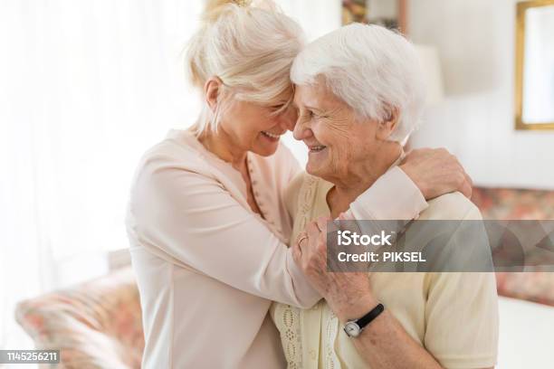 Senior Woman Spending Quality Time With Her Daughter Stock Photo - Download Image Now