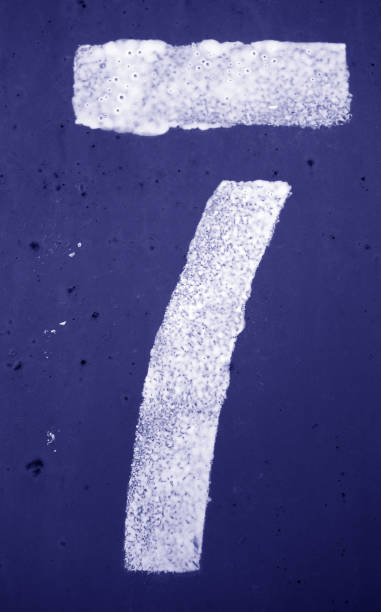 istock Number 7 in stencil on metal wall in blue tone. 1145259553