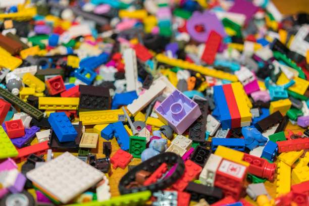 istock Close up of colorful plastic bricks on the floor. Early learning. Children's plastic constructor on the floor. background 1145261771