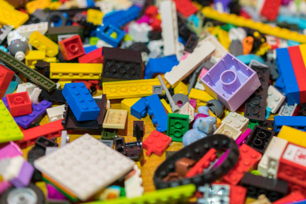 istock Close up of colorful plastic bricks on the floor. Early learning. Children's plastic constructor on the floor. background. 1145262533