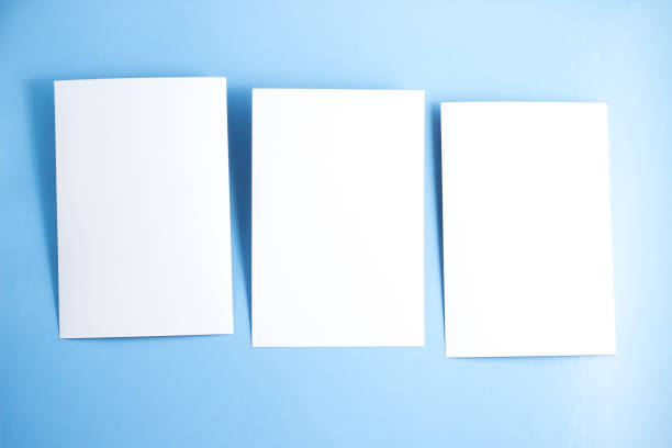 istock Three blanks white postcards / flyers / invitations mock-up on blue background 1145263097