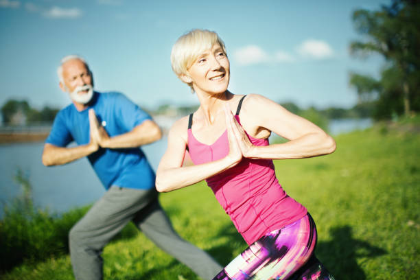istock Yoga class outdoors. 1145264385
