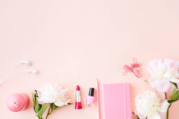 istock Blogger or freelancer workspace with notebook and light pink peonies on a pink background 1145267942