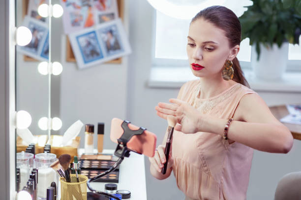 istock Nice pretty woman giving advice about makeup brush 1145268690