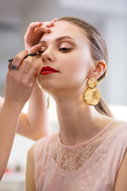 istock Joyful nice woman wanting to look very beautiful 1145268759