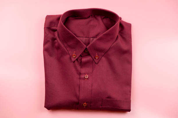 istock Men red shirt on pink background, top view 1145273750