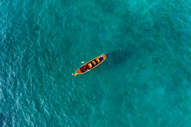 istock View from above, aerial view of a beautiful long tail boat sailing on a turquoise sea. Phi Phi Islands, Maya Bay, Krabi Province, Thailand. 1145274854