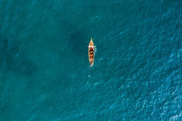 istock View from above, aerial view of a beautiful long tail boat sailing on a turquoise sea. Phi Phi Islands, Maya Bay, Krabi Province, Thailand. 1145274874